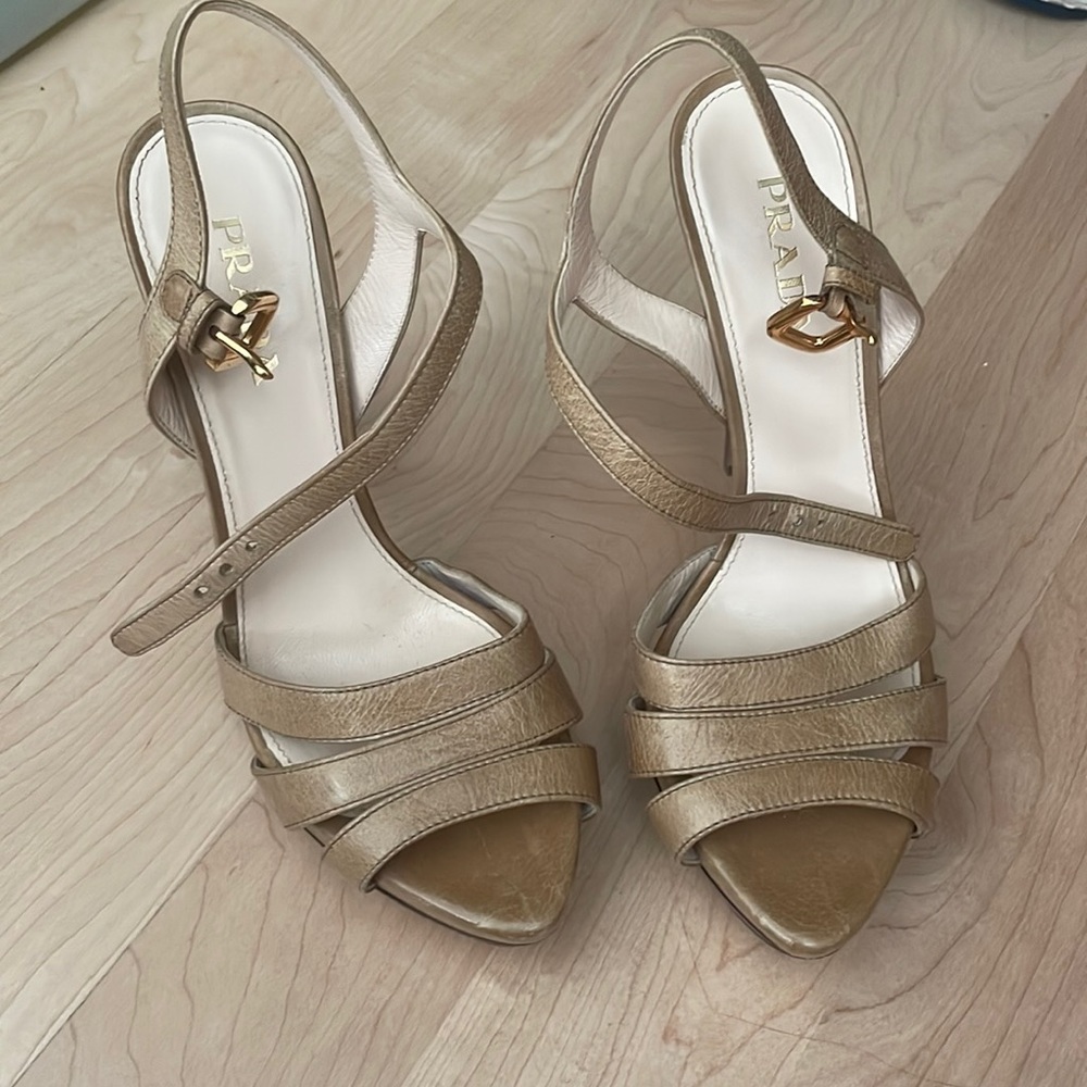 Prada tan heels with gold furnishings!